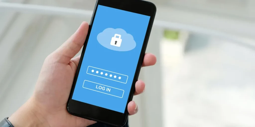 Hand holds mobile with smartphone security app open 