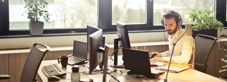 Man sat as desk works from home online