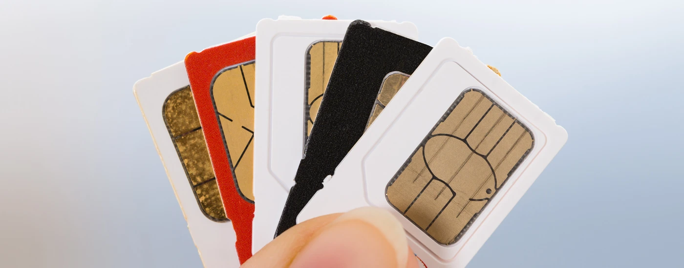 Close up shot of extra SIM card lying with other cards