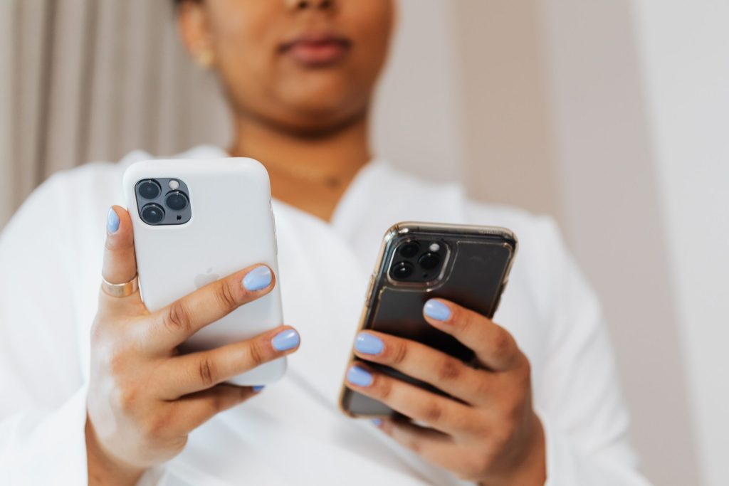 Woman uses two phones with extra SIM at the same time