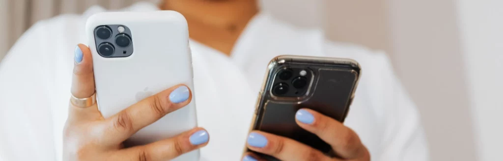 Woman uses business and personal phone at the same time