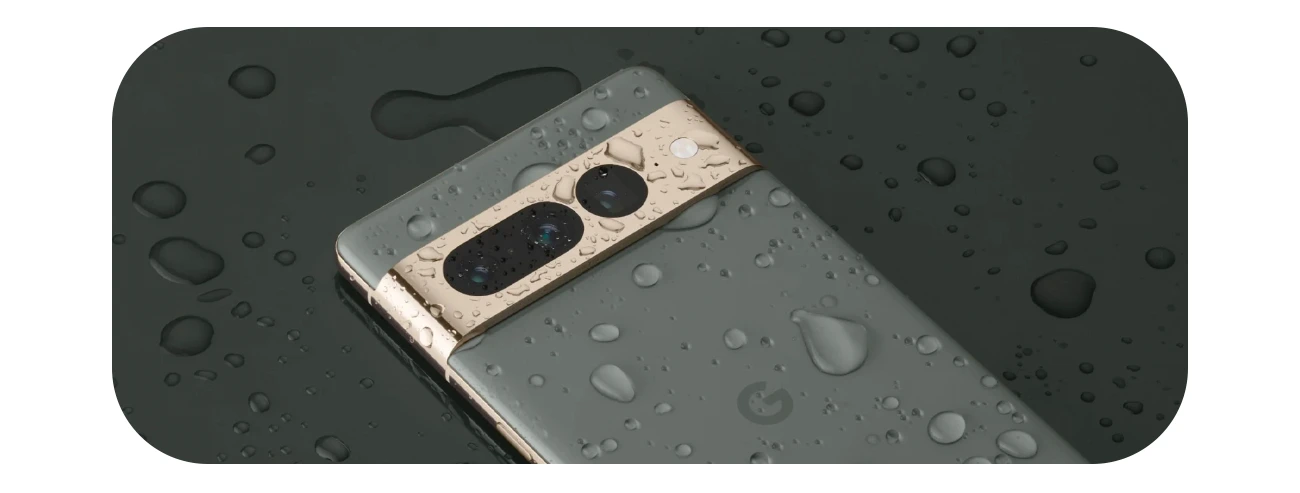 Google Pixel 7 Pro lying face down covered in water droplets 
