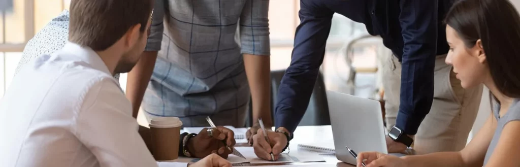 Group of office workers collaborating together