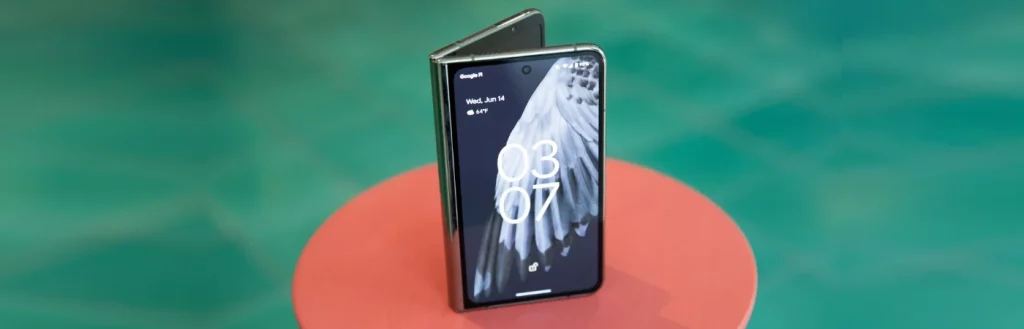 New Google Pixel Fold smart phone folded and standing upright with unlocked display