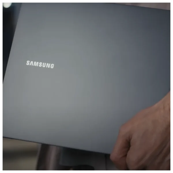 Close up shot of person taking Galaxy Book2 Series to work