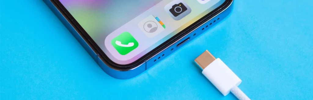 New iPhone 15 concept with USB-C charging cable on blue background