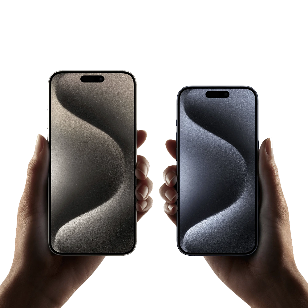 Close up of two hands holding iPhone 15 Pro and Pro Max models, each with unlocked display and Dynamic Island