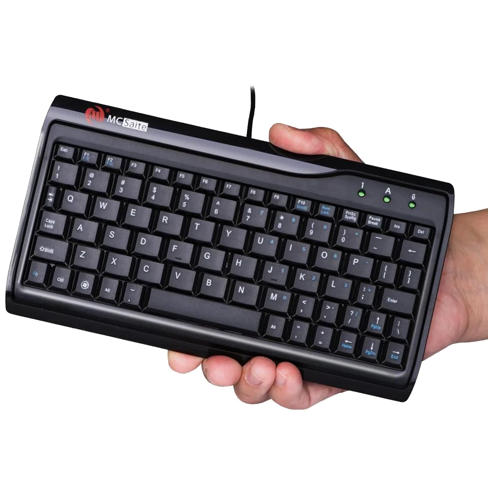 Man holding mini-keyboard in one hand