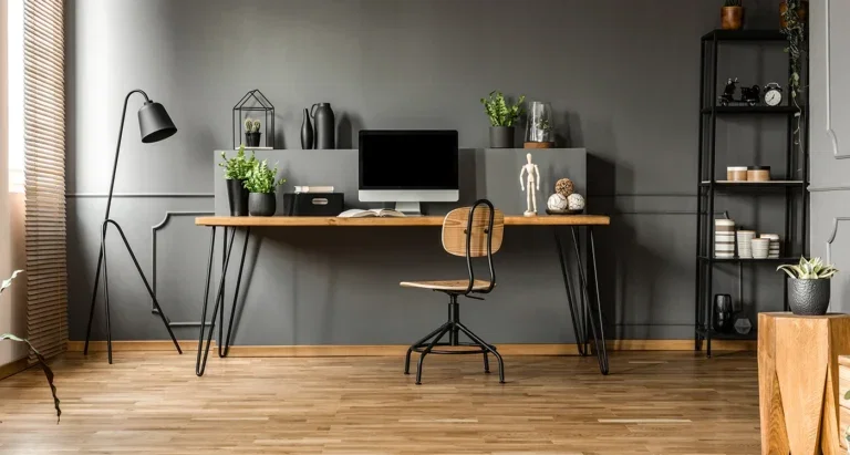 Interior shot of home office with various accessories, including notebook, stationery holder, and desk chair.