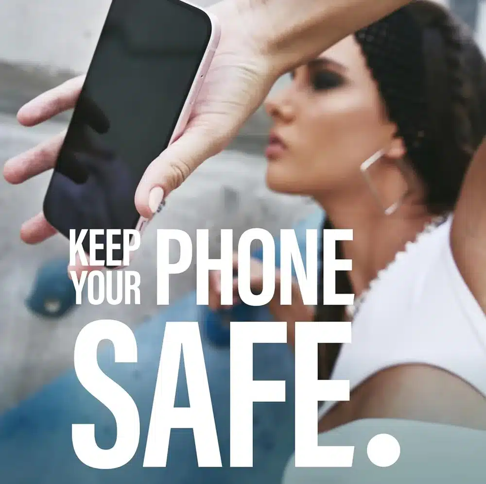 Woman holds iPhone 16 with Panzer Glass Safe screen protector coverage