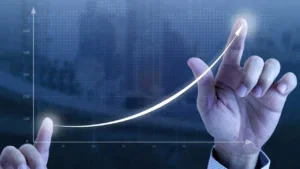Hand charts out business growth graph