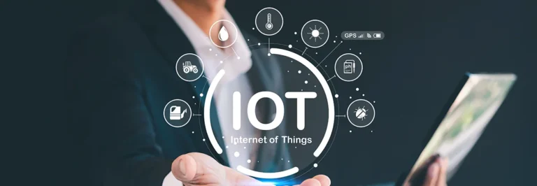 Business professional holding holographic IoT Internet of Things interface with smart device icons